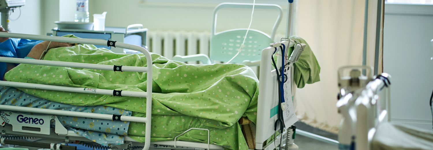 patient in hospital bed at latvian hospital